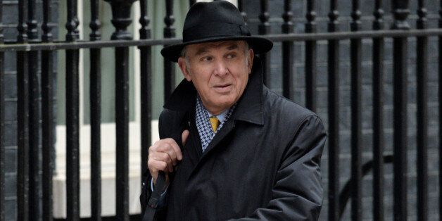 Business Secretary Vince Cable arrives at Downing Street for the Cabinet meeting ahead of today's Budget, London.