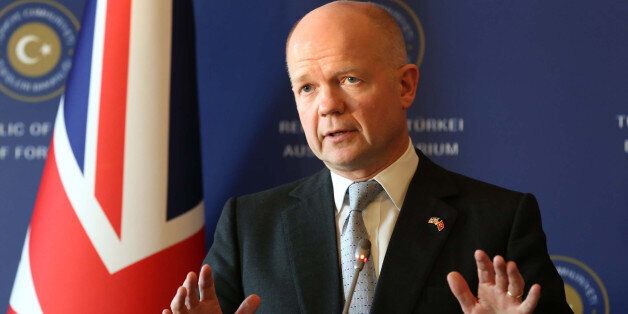 ISTANBUL, TURKEY - NOVEMBER 20: British Foreign Secretary William Hague (in the photo) speaks during a press conference with his Turkish counterpart Ahmet Davutoglu on November 20, 2013 in Istanbul. Hague attends the tenth year commemoration ceremony of the 2003 bomb attacks on the British Consulate General and HSBC Bank offices in Istanbul. (Photo By Hakan Goktepe/Anadolu Agency/Getty Images)