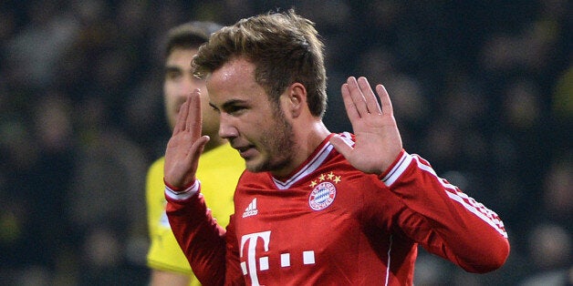 DORTMUND, GERMANY - NOVEMBER 23: Mario Goetze of Munich celebrates after scoring the opening goal during the Bundesliga match between Borussia Dortmund and FC Bayern Muenchen at Signal Iduna Park on November 23, 2013 in Dortmund, Germany. (Photo by Dennis Grombkowski/Bongarts/Getty Images)