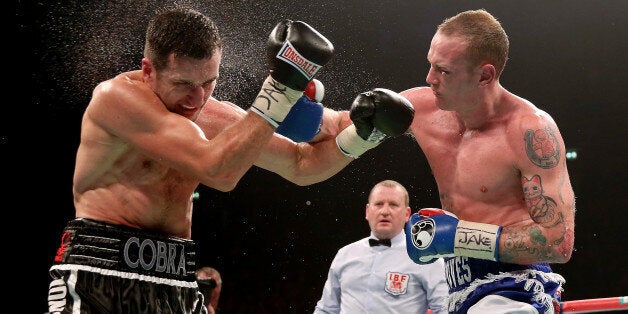 MANCHESTER, ENGLAND - NOVEMBER 23: Carl Froch (L) in action with George Groves during their IBF and WBA World Super Middleweight bout at Phones4u Arena on November 23, 2013 in Manchester, England. (Photo by Scott Heavey/Getty Images)