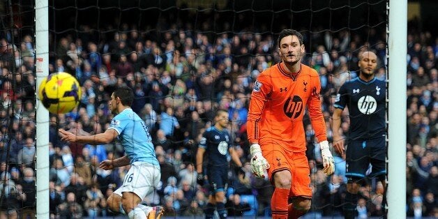 Manchester City's Sergio Aguero celebrates scoring his side's third goal of the game, as Tottenham Hotspur goalkeeper Hugo Lloris looks on dejected