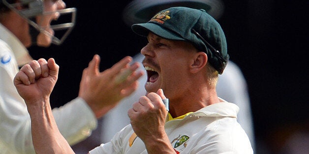 Australia's David Warner (R) shouts to celebrate the dismissal of England's batsman Matt Prior during the day four of the first Ashes cricket Test match between England and Australia at the Gabba Cricket Ground in Brisbane on November 24, 2013. IMAGE RESTRICTED TO EDITORIAL USE - STRICTLY NO COMMERCIAL USE AFP PHOTO / Saeed KHAN (Photo credit should read SAEED KHAN/AFP/Getty Images)