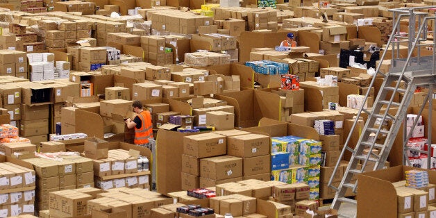 SWANSEA, WALES - NOVEMBER 24: Staff at the Amazon Swansea fulfilment centre process orders as they prepare their busiest time of the year on November 24, 2011 in Swansea, Wales. The 800,000 sq ft fulfilment centre, one the largest of Amazon's six in the UK and the also the world, is gearing up for for both 'Black Friday' and 'Cyber Monday'. Black Friday is traditionally the discount shopping day that follows Thanksgiving in America and signals the start of the Christmas shopping period. In 2010