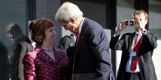 US Secretary of State John Kerry (R) is greeted on September 7, 2013 by European Union High Representative Catherine Ashton as he arrives for a meeting of EU Ministers of Foreign Affairs at the National Gallery of Art in Vilnius. Kerry sought to muster European Union support for military strikes against Syria, after a G20 summit failed to resolve bitter international divisions on the issue. Washington's top diplomat went into informal talks with the EU's 28 foreign ministers in Lithuania, which