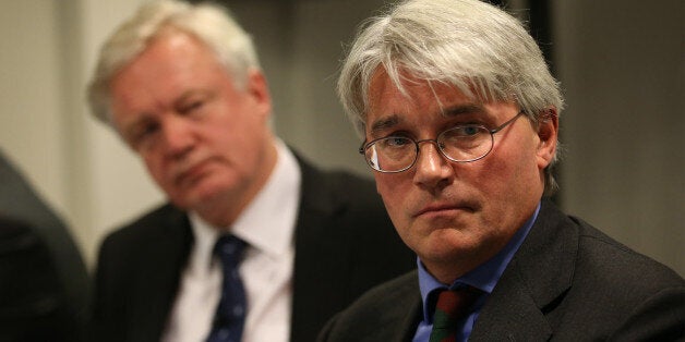 LONDON, ENGLAND - NOVEMBER 26: Former Chief Whip Andrew Mitchell (R) speaks to reporters as David Davies looks on November 26, 2013 in London, England. One police officer is to be charged in connection with a disputed incident involving Mr Mitchell at the gates of Downing Street and five others are to face disciplinary proceedings. (Photo by Peter Macdiarmid/Getty Images)