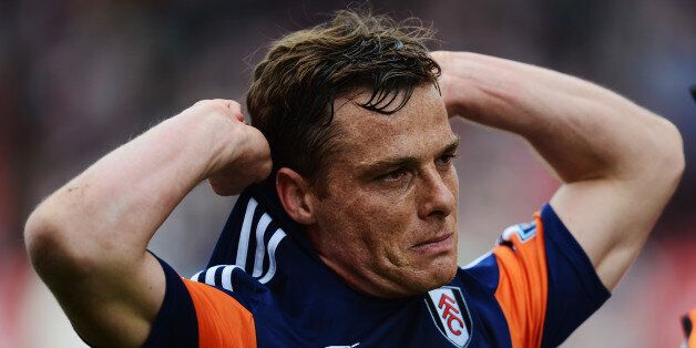 STOKE ON TRENT, ENGLAND - MAY 03: Scott Parker of Fulham reacts as his side are relegated following their defeat in the Barclays Premier League match between Stoke City and Fulham at the Britannia Stadium on May 3, 2014 in Stoke on Trent, England. (Photo by Jamie McDonald/Getty Images)