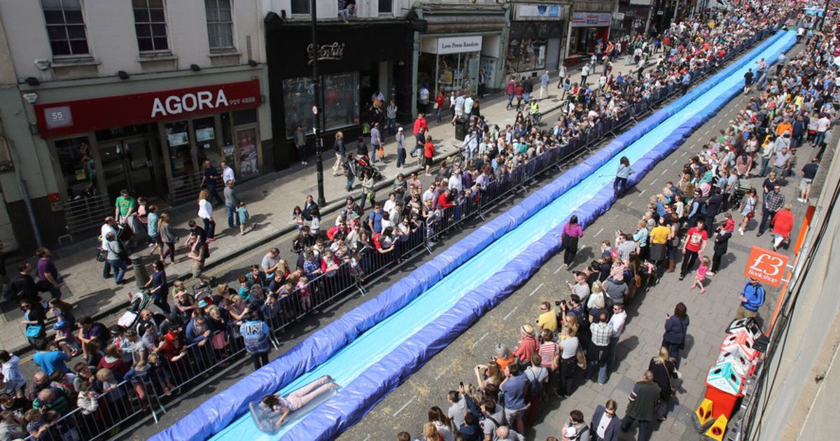 Bristol Water Slide Draws Hundreds Of Thrill Seekers To Park Street