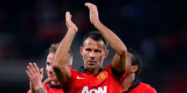 LEVERKUSEN, GERMANY - NOVEMBER 27: Ryan Giggs of Manchester United applauds the fans during the UEFA Champions League Group A match between Bayer Leverkusen and Manchester United at BayArena on November 27, 2013 in Leverkusen, Germany. (Photo by Lars Baron/Bongarts/Getty Images)