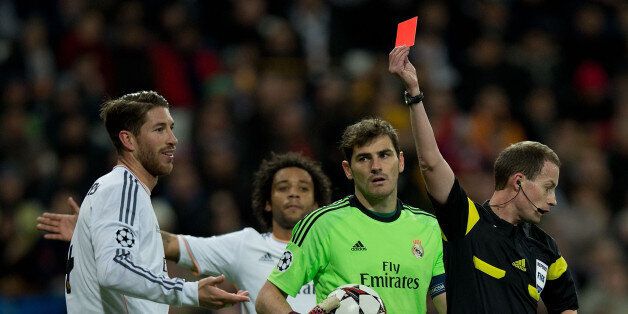 MADRID, SPAIN - NOVEMBER 27: Referee William Collum shows the red card to Sergio Ramos of Real Madrid CF during the UEFA Champions League group B match between Real Madrid CF and Galatasaray AS at Estadio Santiago Bernabeu on November 27, 2013 in Madrid, Spain. (Photo by Gonzalo Arroyo Moreno/Getty Images)