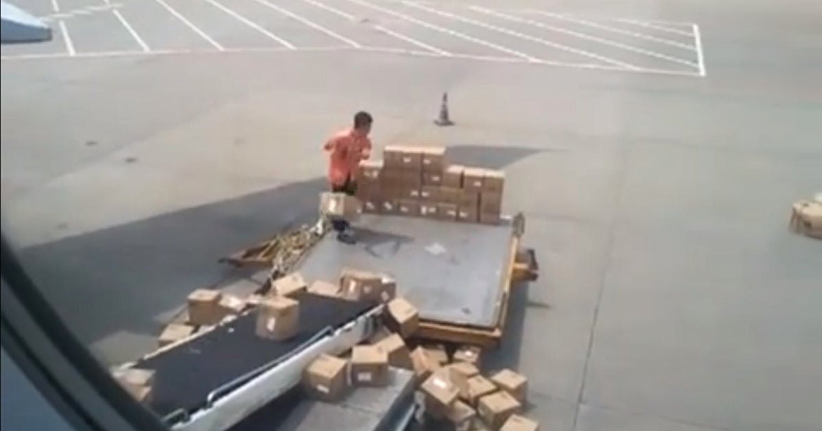 Chinese Air Freight Worker Throws Boxes Onto Plane In Style (VIDEO