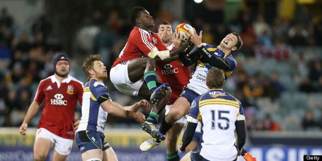 Christian Wade of the Lions competes for the ball in the air with Ian Prior of the Brumbies during the International tour match between the ACT Brumbies in Canberra