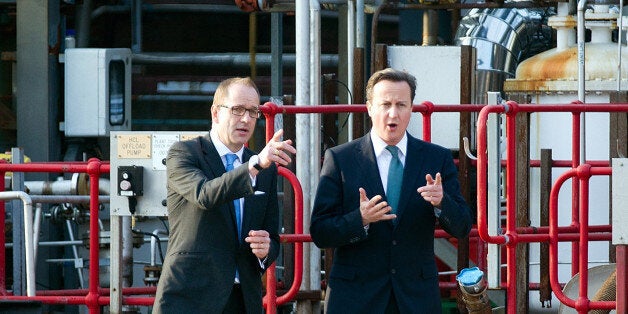 British Prime Minister David Cameron (R) talks with CEO of GlaxoSmithKline Andrew Witty during a visit to GlaxoSmithKline's plant at Ulverston in Cumbria on March 22, 2012. British drugmaker GlaxoSmithKline will create 1,000 jobs and open a new production site in northern England, it said on March 22, citing the government's budget as a key reason for the investment. AFP PHOTO / POOL / James Glossop (Photo credit should read James Glossop/AFP/Getty Images)