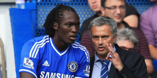 LONDON, ENGLAND - AUGUST 18: Chelsea manager Jose Mourinho talks to substitute Romelu Lukaku of Chelsea during the Barclays Premier League match between Chelsea and Hull City at Stamford Bridge on August 18, 2013 in London, England. (Photo by Richard Heathcote/Getty Images)