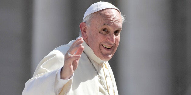 Pope Francis waves after his general audience in St Peter's square at the Vatican on September 18, 2013 . AFP PHOTO / TIZIANA FABI (Photo credit should read TIZIANA FABI/AFP/Getty Images)