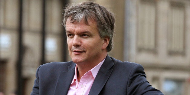 Liberal Democrat MP Michael Moore sits on a park bench close to his constituency office in Galashiels after a TV interview following him being replaced as Scottish Secretary by Orkney and Shetland MP Alistair Carmichael as part of a coalition reshuffle.