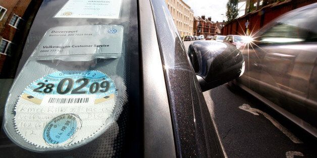 LONDON - AUGUST 04: A 2008/ 2009 car tax disc is displayed in a car windscreen on August 4, 2008 in London, England. Some MPs believe plans for new increased car tax rates on high fuel consumption vehicles should be made bolder to ensure a more effective impact on the environment. (Photo by Cate Gillon/Getty Images)