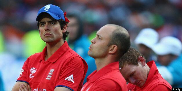 BIRMINGHAM, ENGLAND - JUNE 23: Alastair Cook (L) captain of England looks on dejectedly during the trophy presentation alongside Jonathan Trott (C), Eoin Morgan (R) after their 5 run defeat to India during the ICC Champions Trophy Final match between England and India at Edgbaston on June 23, 2013 in Birmingham, England. (Photo by Michael Steele/Getty Images)