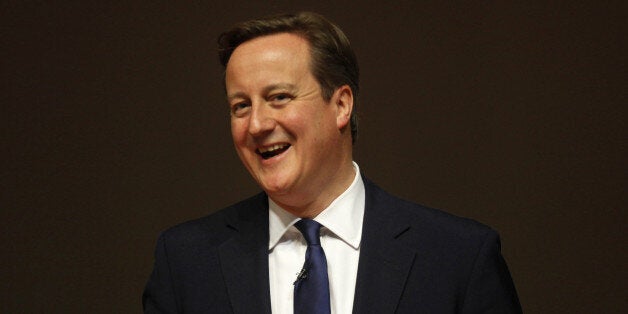 Britain's Prime Minister David Cameron smiles during an interactive session with students of the Indian Institute of Management Calcutta, on the outskirts of Kolkata on November 14, 2013. Cameron is in India for a one day visit ahead of the Commonwealth Head of Government meeting (CHOGM) which is scheduled to be held in the Sri Lankan capital Colombo from November 15-17. AFP PHOTO/POOL/Rupak De Chowdhuri (Photo credit should read RUPAK DE CHOWDHURI/AFP/Getty Images)