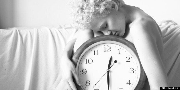 Stock image of woman holding clock