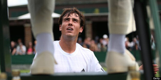 Guido Pella of Argentina speaks with the chair umpire during his Gentlemen's Singles first round match against Jesse Levine