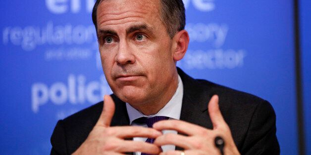 Mark Carney, governor of the Bank of England and chairman of the Financial Stability Board (FSB), gestures during a news conference following the board's plenary meeting at the Bank of England in London, U.K., on Monday, March 31, 2014. Carney said the FSB wants lenders and the International Swaps and Derivatives Association Inc., an industry group, to come up with proposals to write temporary pauses into derivatives contracts struck with banks that hit financial trouble. Photographer: Simon Daw