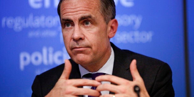 Mark Carney, governor of the Bank of England and chairman of the Financial Stability Board (FSB), gestures during a news conference following the board's plenary meeting at the Bank of England in London, U.K., on Monday, March 31, 2014. Carney said the FSB wants lenders and the International Swaps and Derivatives Association Inc., an industry group, to come up with proposals to write temporary pauses into derivatives contracts struck with banks that hit financial trouble. Photographer: Simon Daw