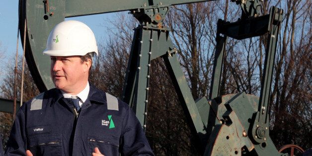 Prime Minister David Cameron looks on during a guided tour of the IGas shale drilling plant oil depot near Gainsborough, Lincolnshire.