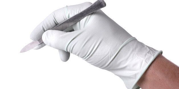 hand holding scalpel