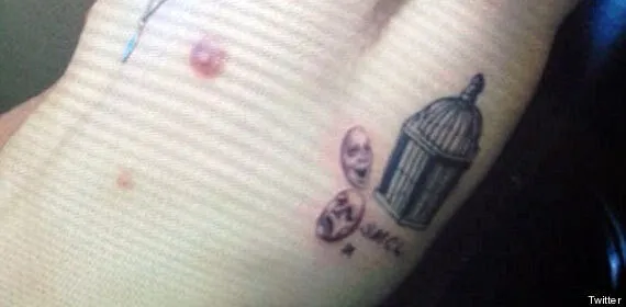 One Direction's Louis Tomlinson reveals yet ANOTHER tattoo a tribute to  his old band The Rogues on his shins