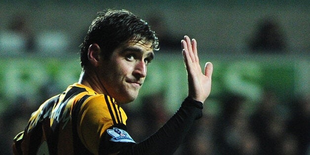 SWANSEA, WALES - DECEMBER 09: Hull striker and former Swansea player Danny Graham (r) apologises to the Swansea fans after opening the scoring during the Barclays Premier league match between Swansea City and Hull City at the Liberty Stadium on December 9, 2013 in Swansea, Wales. (Photo by Stu Forster/Getty Images)