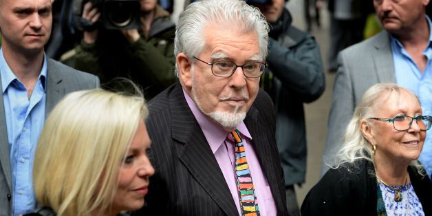 Veteran entertainer Rolf Harris arrives with daughter Bindi (left) and wife Alwen at Southwark Crown Court, London where he faces charges of alleged indecent assaults on under-age girls.