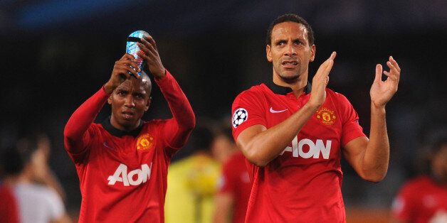 SAN SEBASTIAN, SPAIN - NOVEMBER 05: Ashley Young (L) and Rio Ferdinand of Manchester United applaud the travelling Manchester United fans at the end of the UEFA Champions League Group A match between Real Sociedad and Manchester United at Estadio Anoeta on November 5, 2013 in San Sebastian, Spain. (Photo by Mike Hewitt/Getty Images)