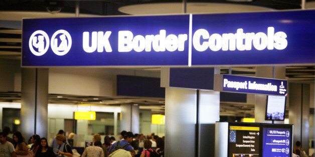 Border Control in Terminal Five of London's Heathrow Airport where some immigration and customs staff have joined a day of strikes by teachers, civil servants and other workers over Government plans to change their pensions, cut jobs and freeze pay.