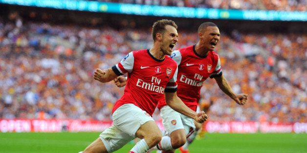 LONDON, ENGLAND - MAY 17: Aaron Ramsey of Arsenal celebrates with team-mate Kieran Gibbs after scoring their third goal during the FA Cup with Budweiser Final match between Arsenal and Hull City at Wembley Stadium on May 17, 2014 in London, England. (Photo by Steve Bardens - The FA/The FA via Getty Images)