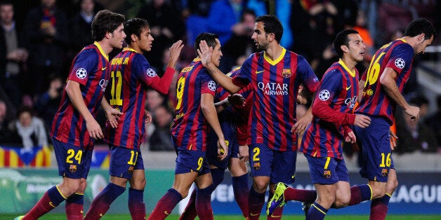 BARCELONA, SPAIN - DECEMBER 11: FC Barcelona players celebrate after Gerard Pique of FC Barcelona scored the opening goal during the Champions League Group H match between FC Barcelona and Celtic FC at Camp Nou on December 11, 2013 in Barcelona, Spain. (Photo by David Ramos/Getty Images)