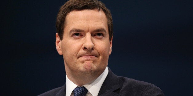 MANCHESTER, ENGLAND - SEPTEMBER 30: Chancellor of the Exchequer George Osborne delivers his speech in the main hall on the second day of the Conservative Party Conference on September 30, 2013 in Manchester, England. Osborne has unveiled a Government plan for long-term unemployed people to undertake work placements in order to receive their benefits. (Photo by Oli Scarff/Getty Images)