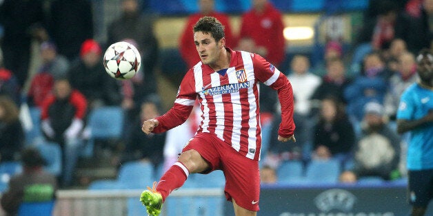 MADRID, SPAIN - DECEMBER 11: Jorge Resurreccion aka Koke of Atletico in action during the UEFA Champions League match between Atletico de Madrid and FC Porto at the Estadio Vicente Calderon stadium on December 11, 2013 in Madrid, Spain. (Photo by John Berry/Getty Images)