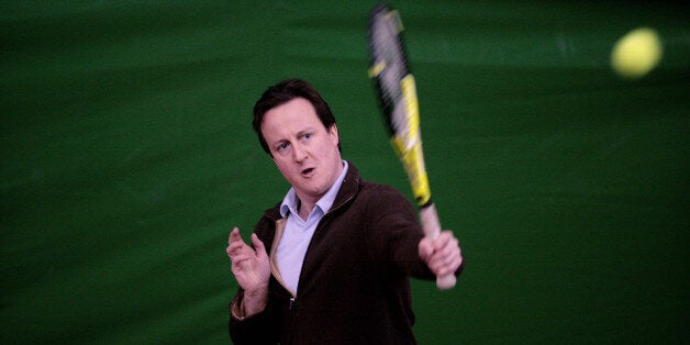 Tory leader David Cameron plays tennis during his visit to the FC** Tennis Academy at the Hazelwood Lawn Tennis and Squash Club, in Enfield, London, to launch the Conservative's National Lottery Independence Bill.