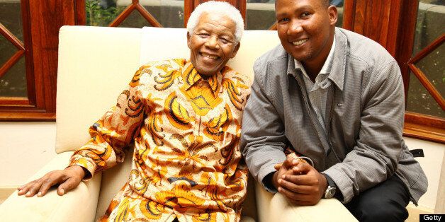 Chief Mandla Mandela with his grandfather Nelson Mandela as they share a joke on March 27, 2010 in Johannesburg, South Africa.