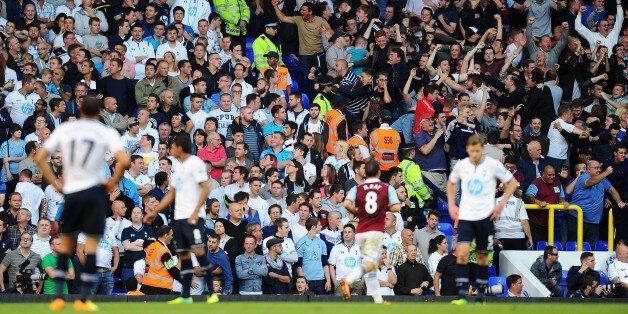 LONDON, ENGLAND - OCTOBER 06: West Ham fans celebrate their side's second goal during the Barclays Premier League match between Tottenham Hotspur and West Ham United at White Hart Lane on October 6, 2013 in London, England. (Photo by Mike Hewitt/Getty Images)