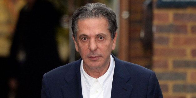 Charles Saatchi leaves Isleworth Crown Court in London, where the trial of sisters Elisabetta 'Lisa' and Francesca Grillo is being held.