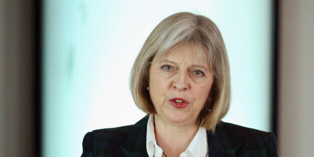 HOOK, HAMPSHIRE - OCTOBER 24: Home Secretary Theresa May addresses The College of Policing Conference on October 24, 2013 in Bramshill near Hook, England. In her keynote speech Home Secretary Theresa May announced that the expansion of the Independent Police Complaints Commission is 'on track' and will begin to investigate new cases in the new year. (Photo by Oli Scarff/Getty Images)