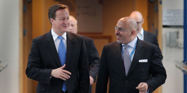 BIRMINGHAM, ENGLAND - OCTOBER 05: Prime Minister David Cameron (L) walks with Conservative MP Nadhim Zahawi at the Conservative Party Conference during a television interview on October 5, 2010 in Birmingham, England. On the third day of the conference speakers are set to debate public services, crime and justice and poverty. (Photo by Peter Macdiarmid/Getty Images)