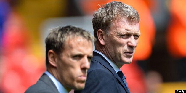 Everton's English defender Phil Neville (L) stands with manager David Moyes before the start of the English Premier League football match between Liverpool and Everton at the Anfield stadium in Liverpool, northwest England, on May 5, 2013. AFP PHOTO / PAUL ELLIS RESTRICTED TO EDITORIAL USE. No use with unauthorized audio, video, data, fixture lists, club/league logos or ?live? services. Online in-match use limited to 45 images, no video emulation. No use in betting, games or single club/league/