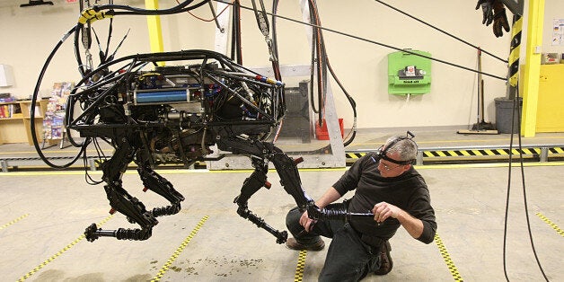 WALTHAM, MA - FEBRUARY 3: A BigDog robot at Boston Dynamics. Innovation Economy column on local robotics company called Boston Dynamics, which mainly does military contracting work - they just won a big contract this week from the Department of Defense. One of their robots, called BigDog, is being developed to help soldiers carry heavy equipment in the field -- it can literally follow a human being, walking across wet/sandy/rocky terrain, just like a dog would. (Photo by Suzanne Kreiter/The Boston Globe via Getty Images)