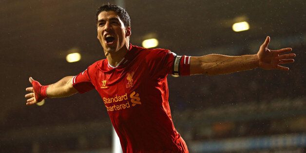 LONDON, ENGLAND - DECEMBER 15: Luis Suarez of Liverpool celebrates scoring their fourth goal during the Barclays Premier League match between Tottenham Hotspur and Liverpool at White Hart Lane on December 15, 2013 in London, England. (Photo by Paul Gilham/Getty Images)
