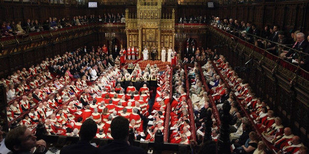 Queen Elizabeth II, accompanied by the Duke of Edinburgh, reads her speech during the State Opening of Parliament in the House of Lords, London.