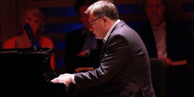 LONDON, ENGLAND - DECEMBER 08: Labour Party Shadow Chancellor Ed Balls plays on the piano a movement from composer Robert Schumann's Kinderszenen (Scenes from Childhood) on stage during Celebrity Carnival: Lucy Parham & Friends at Kings Place on December 8, 2013 in London, United Kingdom. (Photo by Amy T. Zielinski/Redferns via Getty Images)