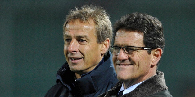 Russian men's national team head coach Fabio Capello (R) speaks with US men's national team head coach Jurgen Klinsmann (L) before their friendly football match in the southern Russian city of Krasnodar, on November 14, 2012. AFP PHOTO (Photo credit should read STR/AFP/Getty Images)