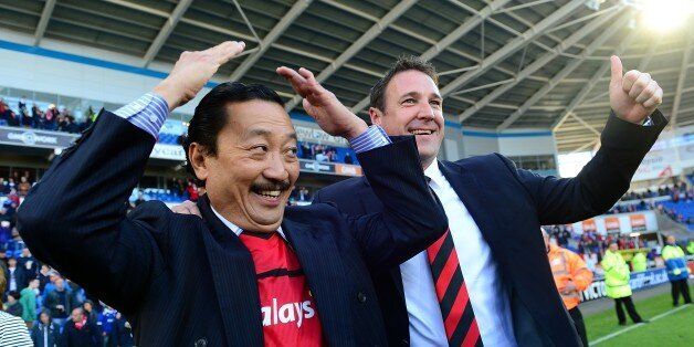 Cardiff City Chairman Vincent Tan (left) and manager Malky Mackay winning the npower Football League Championship